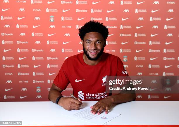 Joe Gomez signing a contract extension for Liverpool at AXA Training Centre on July 07, 2022 in Kirkby, England.