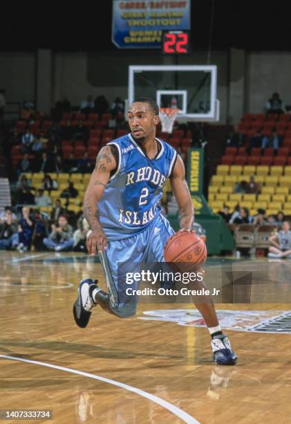 Dinno Daniels, Guard for the University of Rhode Island Rams dribbles the basketball down court during the NCAA Great Alaska Shootout college...