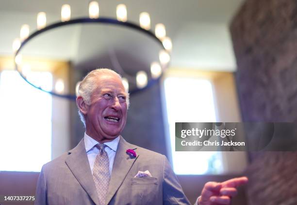 Prince Charles, Prince Of Wales laughs during a visit to Hay Castle on July 07, 2022 in Hay-on-Wye, Wales.This summer, Hay Castle opens its doors to...