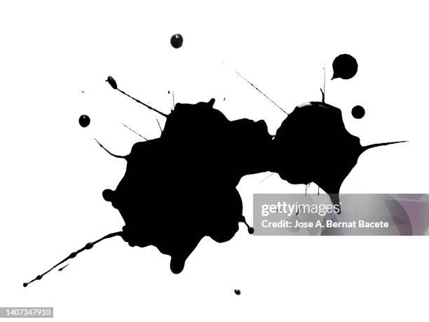 splashes of a drop of black paint on a white canvas. - ink photos et images de collection