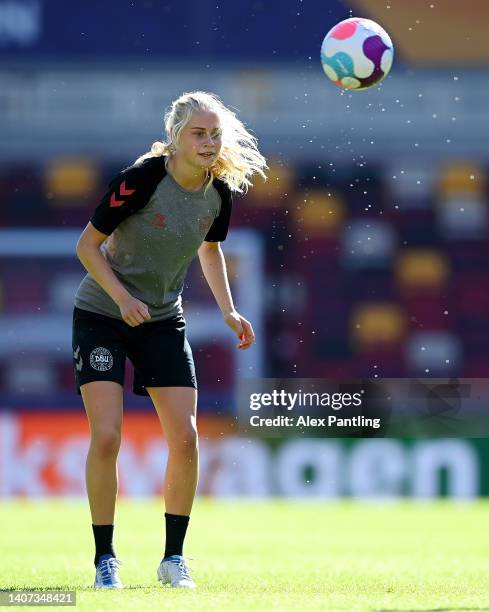 Kathrine Moller Kuhl of Denmark warms up during the UEFA Women's Euro 2022 Denmark Training Session at Brentford Community Stadium on July 07, 2022...