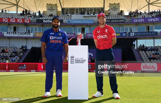 England captain Jos Buttler alongside India captain Rohit Sharma with series trophy ahead of the 1st Vitality IT20 match between England and India at...