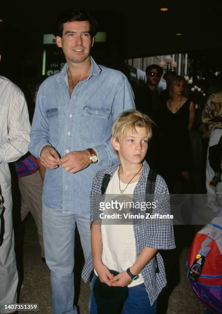 Pierce Brosnan smiles beside his young son Sean Brosnan at the premiere of "Home Alone 2: Lost in New York" in Century City, California, United...