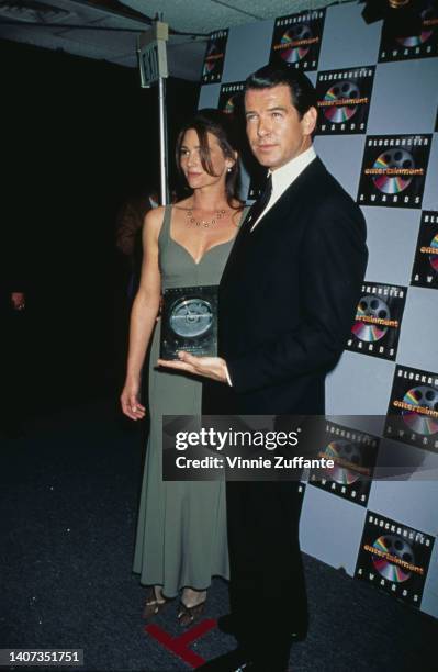 Pierce Brosnan and partner Keely Shaye Smith backstage at the 1996 2nd Annual Blockbuster Entertainment Awards, held at Pantages Theatre in Los...