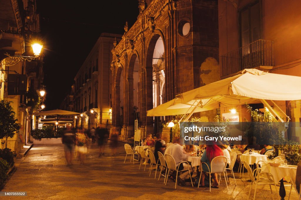 Busy street at night in Trapani