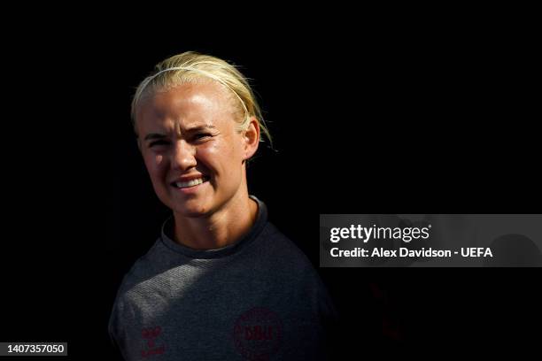 Pernille Harder of Denmark enters the pitch to warm up during the UEFA Women's Euro 2022 Denmark Training Session at Brentford Community Stadium on...