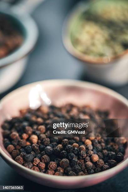 green, white, black and mixed peppercorns on a spoon - black pepper stock pictures, royalty-free photos & images