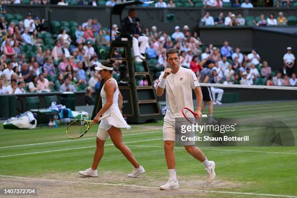 Desirae Krawczyk of The United States and partner Neal Skupski of Great Britain celebrate a point against Matthew Ebden of Australia and Samantha...