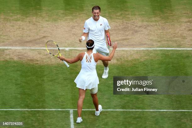 Desirae Krawczyk of The United States and partner Neal Skupski of Great Britain celebrate winning Championship point against Matthew Ebden of...