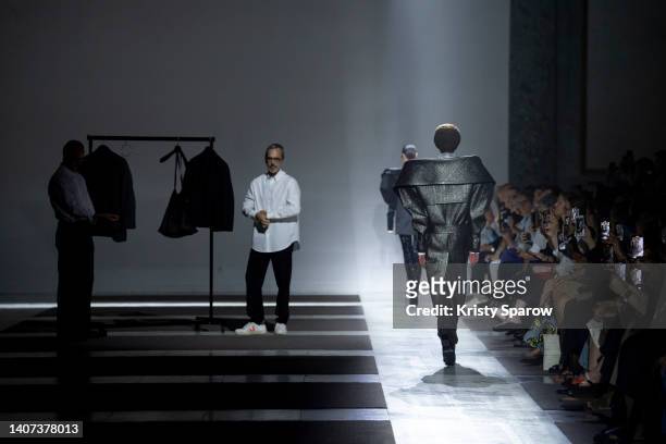 Designers Viktor Horsting and Rolf Snoeren dress a model during the Viktor & Rolf Haute Couture Fall Winter 2022 2023 show as part of Paris Fashion...
