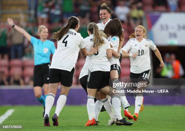 Julie Nelson of Northern Ireland celebrates with teammates after scoring their team's first goal during the UEFA Women's Euro 2022 group A match...