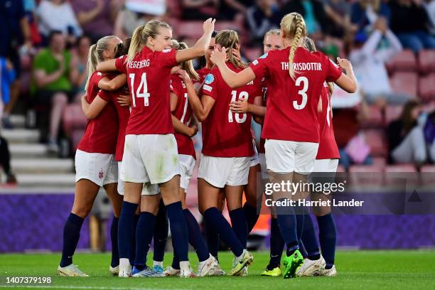 Guro Reiten of Norway celebrates with teammates after scoring their team's fourth goal during the UEFA Women's Euro 2022 group A match between Norway...