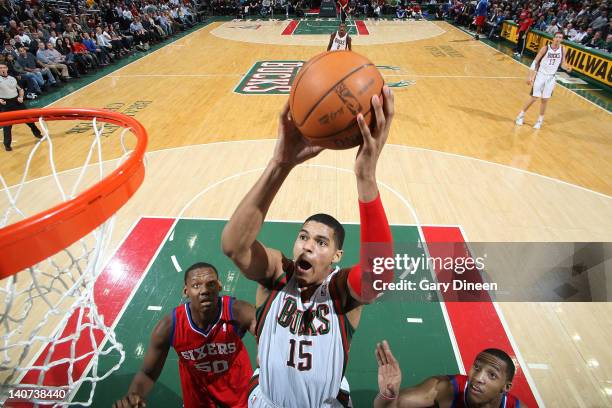 March 5: Tobias Harris of the Milwaukee Bucks shoots a layup against Lavoy Allen and Evan Turner of the Philadelphia 76ers during the game on March...