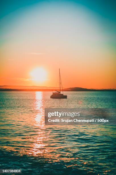 scenic view of sea against sky during sunset,noosa heads,queensland,australia - noosa queensland stock pictures, royalty-free photos & images