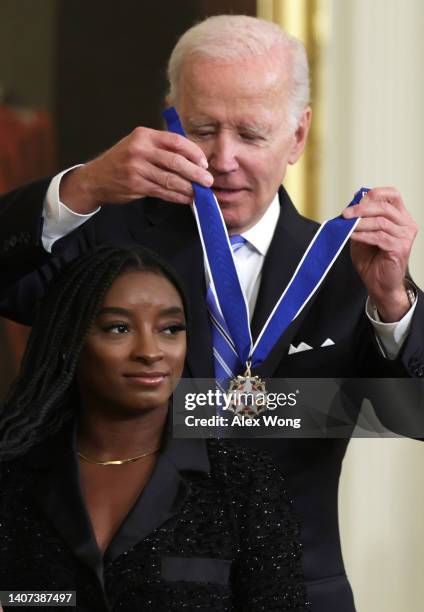 President Joe Biden presents the Presidential Medal of Freedom to Simone Biles, Olympic gold medal gymnast and mental health advocate, during a...