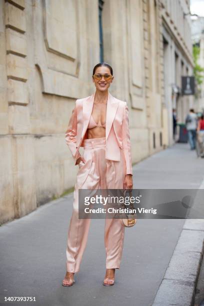 Sabina Jakubowicz seen wearing salmon colored blazer, pants, bag, heels, sunglasses, bikini topoutside Fendi during Paris Fashion Week - Haute...