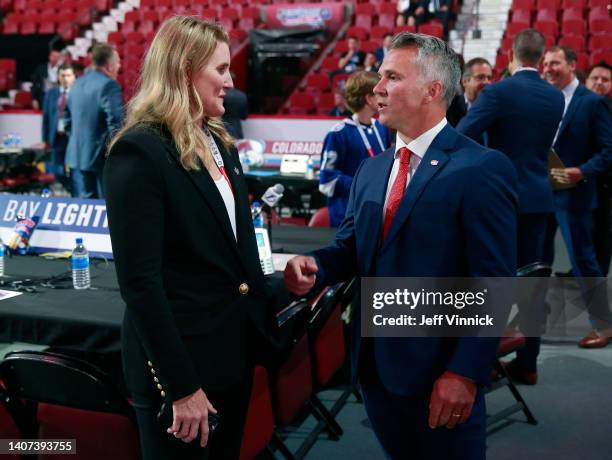 Assistant general manager Hayley Wickenheiser of the of the Toronto Maple Leafs and head coach Martin St. Louis of the Montreal Canadiens talk on the...