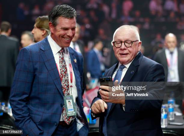 Head coach Mike Sullivan of the Pittsburgh Penguins and president of hockey operations Jim Rutherford of the Vancouver Canucks look on prior to the...