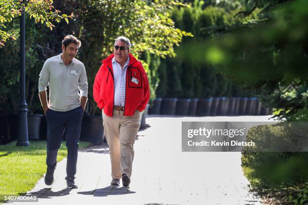 Tom Bernthal, consultant and former NBC News producer, and Phil Deutch, Founder of Ngp Energy Technology Partners, walk together during the Allen &...