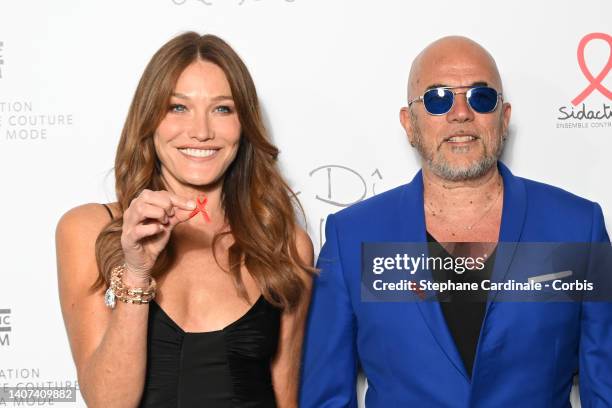 Carla Bruni and Pascal Obispo attend the "Diner De La Mode" to benefit Sidaction at Pavillon Cambon Capucines on July 07, 2022 in Paris, France.