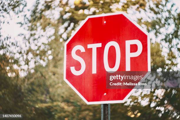 close-up of a stop sign. - stop single word stock pictures, royalty-free photos & images