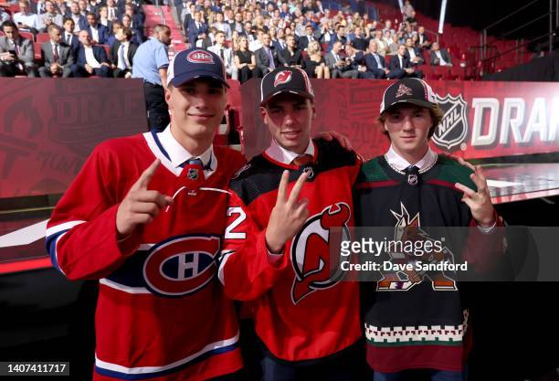 Juraj Slafkovsky of the Montreal Canadiens, first overall pick, Simon Nemec of the New Jersey Devils, second overall pick, and Logan Cooley of the...