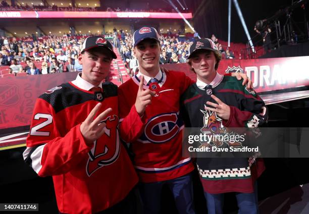 Simon Nemec of the New Jersey Devils, second overall pick, Juraj Slafkovsky of the Montreal Canadiens, first overall pick, and Logan Cooley of the...