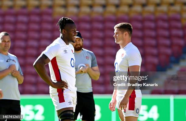 Maro Itoje and Owen Farrell chat during the England Rugby squad captain's run at Suncorp Stadium on July 08, 2022 in Brisbane, Australia.