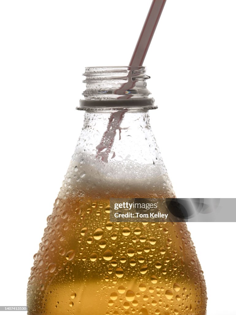 Ginger ale bottle with straw