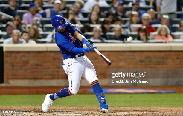Davis of the New York Mets connects on his fifth inning grand slam home run against the Miami Marlins at Citi Field on July 07, 2022 in New York City.
