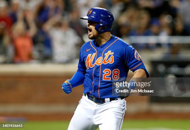 Davis of the New York Mets reacts after his fifth inning grand slam home run against the Miami Marlins at Citi Field on July 07, 2022 in New York...