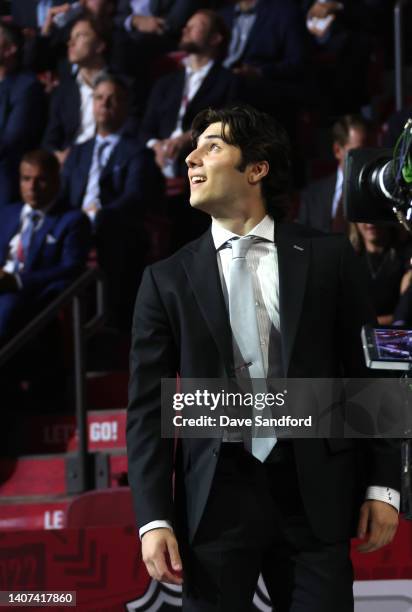 Frank Nazar walks toward the stage after being selected 13th overall by the Chicago Blackhawks during the first round of the 2022 Upper Deck NHL...
