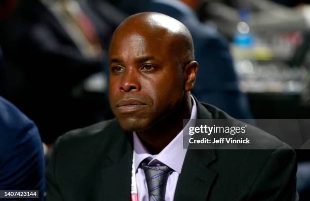 General manager Mike Grier of the San Jose Sharks looks on from the draft table during the first round of the 2022 Upper Deck NHL Draft at Bell...