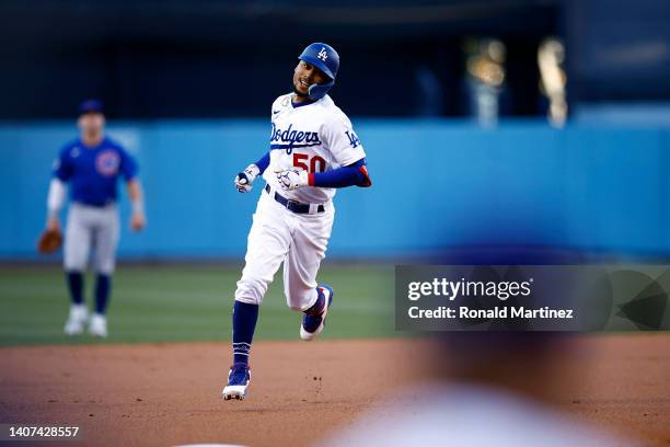 Mookie Betts of the Los Angeles Dodgers celebrates a home run against the Chicago Cubs in the first inning at Dodger Stadium on July 07, 2022 in Los...