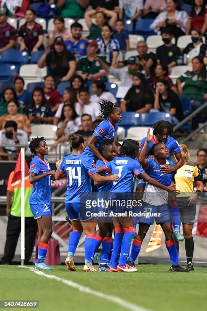 Roselord Borgella of Haiti celebrates with teammates after scoring her team’s first goal during the match between Haiti and Mexico as part of the...