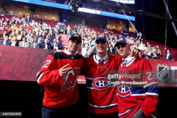 Simon Nemec of the New Jersey Devils, Juraj Slafkovsky of the Montreal Canadiens, and Filip Mesar of the Montreal Canadiens pose for a picture during...