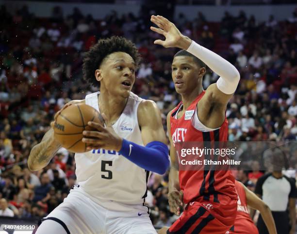 Paolo Banchero of the Orlando Magic drives against Jabari Smith Jr. #1 of the Houston Rockets during the 2022 NBA Summer League at the Thomas & Mack...