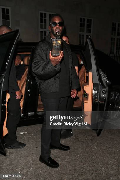 Sean Diddy Combs seen celebrating Naomi Campbell's honorary doctorate presented to her during the graduation ceremony of UCA Epsom students with a...
