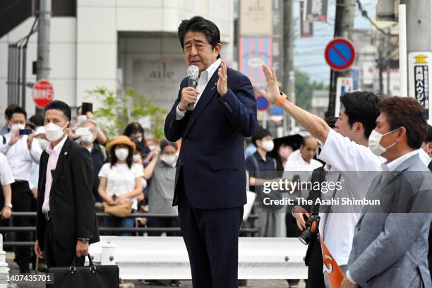 Former Prime Minister Shinzo Abe makes a street speech before being shot in front of Yamatosaidaiji Station on July 8, 2022 in Nara, Japan. Abe...