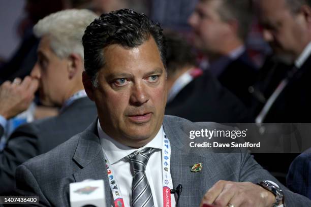 General manager Bill Guerin of the Minnesota Wild looks on from the draft table during the first round of the 2022 Upper Deck NHL Draft at Bell...