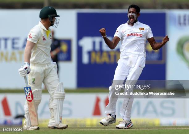 Kasun Rajitha of Sri Lanka celebrates after dismissing David Warner of Australia during day one of the Second Test in the series between Sri Lanka...