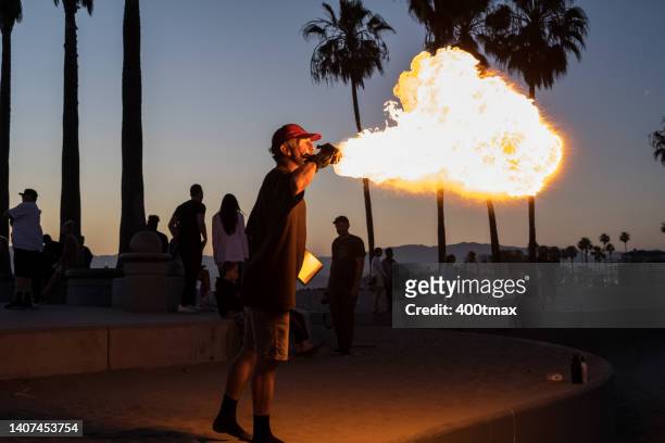 venice beach - fire performer stock pictures, royalty-free photos & images