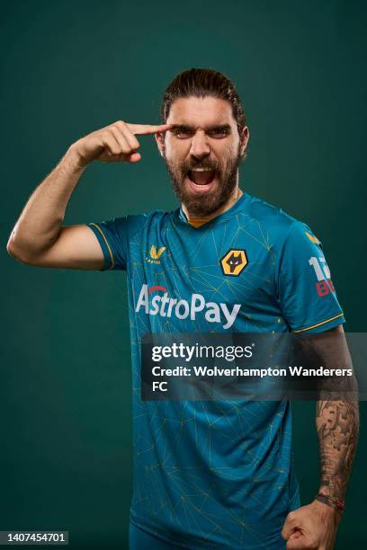 Ruben Neves of Wolverhampton Wanderers poses for a portrait in the Wolverhampton Wanderers Season 2022/23 Away Kit at The Sir Jack Hayward Training...