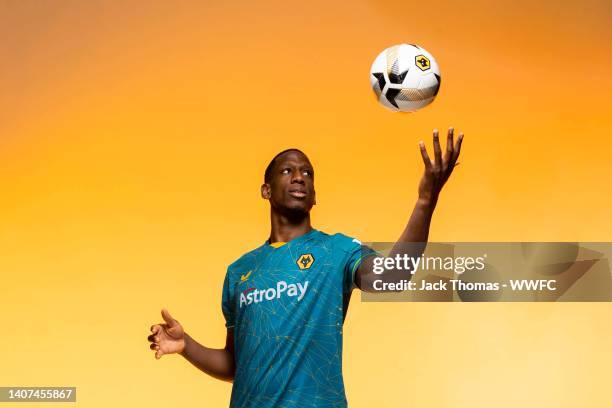 Willy Boly of Wolverhampton Wanderers poses for a portrait in the Wolverhampton Wanderers Season 2022/23 Away Kit at The Sir Jack Hayward Training...