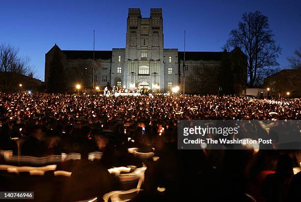 Massive candlelight vigil is held on the drill field in front of Burruss Hall, the center piece of the Virginia Tech campus.