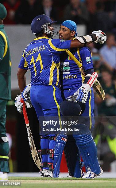 Kumar Sangakkara of Sri Lanka congratulates Tillakaratne Dilshan of Sri Lanka after he scored his century during the second One Day International...