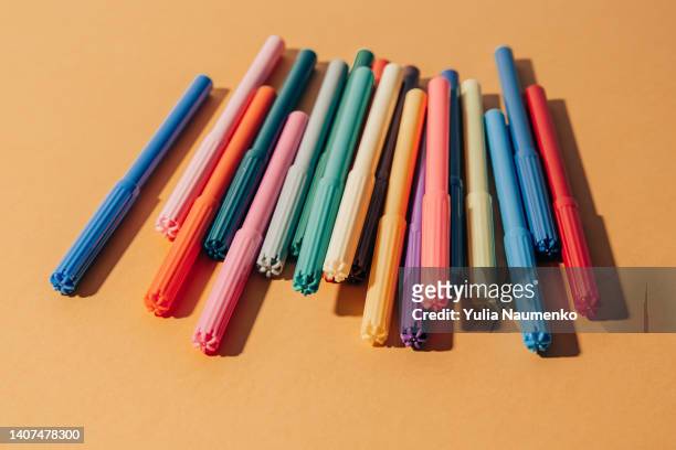 school supplies on orange background. - creative director stock pictures, royalty-free photos & images