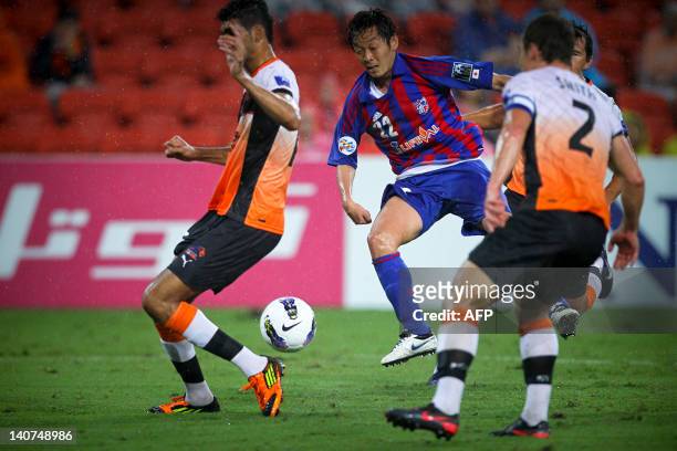 Hanyu Naotake of FC Tokyo passes the ball against the Brisbane Roar during the group stage football match of the AFC Champions League in Brisbane on...