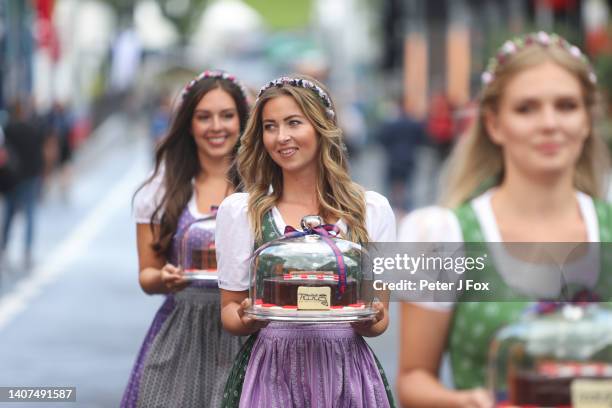 Local girls in the paddock during practice/qualifying ahead of the F1 Grand Prix of Austria at Red Bull Ring on July 08, 2022 in Spielberg, Austria.