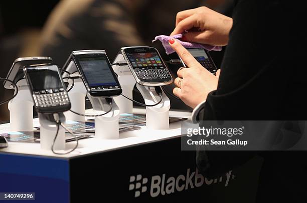 Visitors try out Blackberry smartphones at the Blackberry stand on the first day of the CeBIT 2012 technology trade fair on March 6, 2012 in Hanover,...